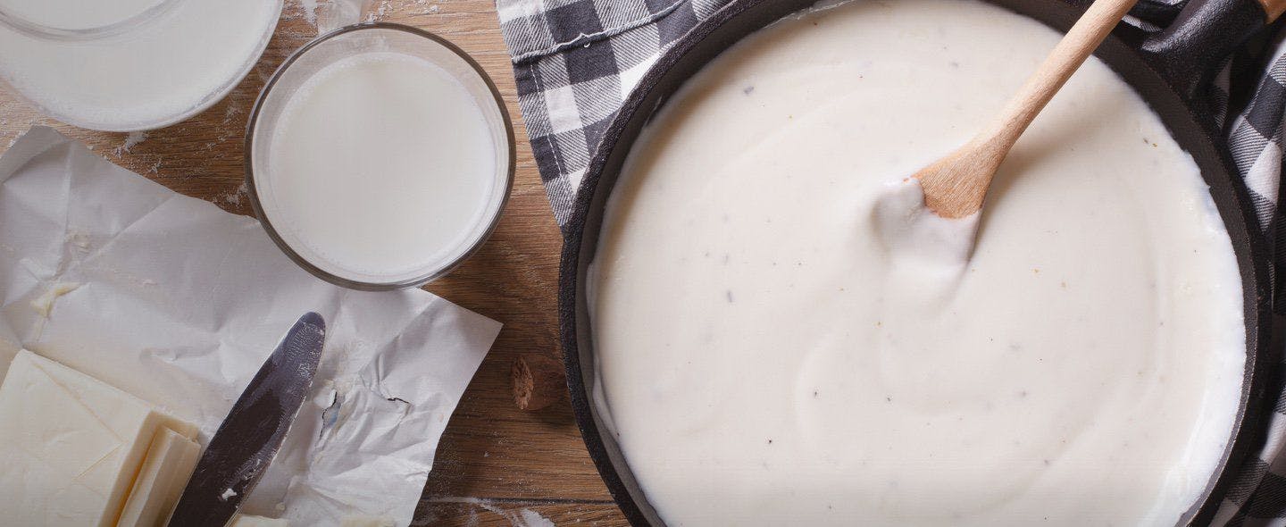 A creamy white sauce on a table.